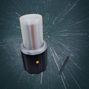 May include: A cylindrical, clear, and white object with a red stripe, atop a black base with a gold-coloured button. A small, black, rectangular object is next to it. The background is a dark teal with white starbursts.