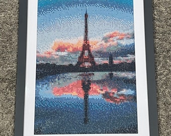 Eiffel Tower reflection over the water.