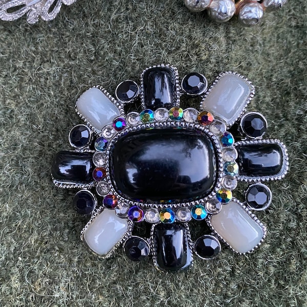 Statement 1980's style black and grey brooch with faux gemstones in a grey metal setting