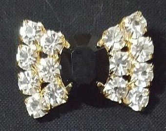 Black and clear faceted rhinestone bow shaped glamour buttons set in gold metal with shank 1 1/8" diameter