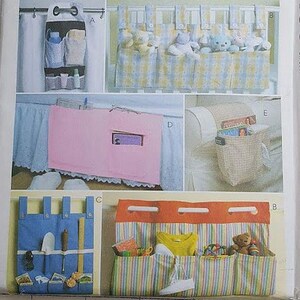 May include: A McCall's Home Decorating pattern envelope featuring various organizer designs. The image showcases different styles of hanging organizers, including those with pockets and compartments, in various colors and patterns. The text "ORGANIZER ESSENTIALS" is visible.