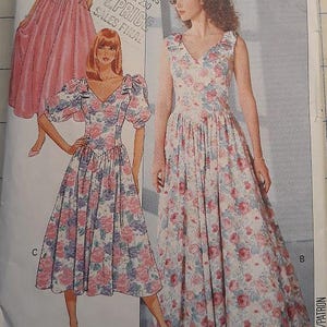 May include: Butterick sewing pattern featuring illustrations of three different dresses. The dresses are in pink and floral patterns. The pattern includes the text "AVERAGE/MOINS FACILE" and size information.