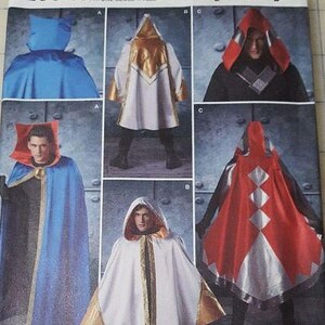 May include: Simplicity sewing pattern number 8238 for a cape. The pattern includes five different styles of capes, including a white cape with gold trim, a red and white cape, and a blue cape. The pattern is designed and printed in the USA.