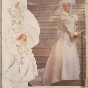 May include: Simplicity sewing pattern featuring a wedding dress design. The cover shows a woman in a white wedding gown with long sleeves, a veil, and a bouquet. The pattern includes sizes R5 (14-22).