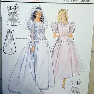 May include: A Burda Couture sewing pattern featuring illustrations of two wedding dresses. One dress is white with long sleeves and a veil, the other is pink with short sleeves. The pattern includes sizes 8-18.