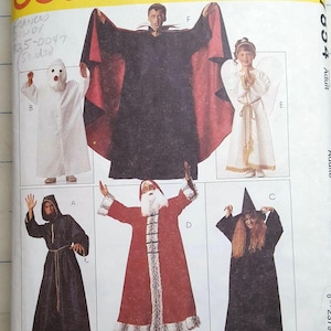 May include: A vintage McCall's Costumes pattern featuring six different Halloween costume designs. The costumes include a vampire, angel, witch, Santa Claus, and a hooded monk. The pattern is labeled "Easy" and includes sizes for boys, girls, and adults.