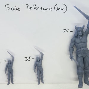 May include: Three gray plastic figurines of a warrior holding a sword, with measurements in millimeters: 32 mm, 35 mm, and 75 mm.  Scale Reference (mm) is written at the top of the image.