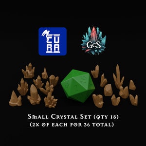 May include: A set of 18 small brown crystal miniatures, with a green 20-sided die in the center. The set includes a variety of crystal shapes and sizes. The text "SMALL CRYSTAL SET (QTY 18)" and "(2X OF EACH FOR 36 TOTAL)" is displayed below the crystals.