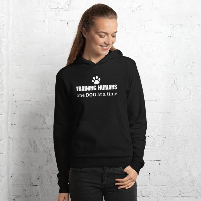 Funny dog trainer hoodie sweatshirt. Dog trainer gift. Hoodie that says Training Humans one DOG at a time.
