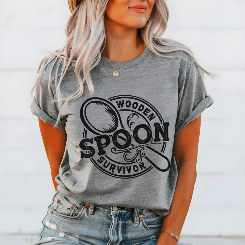 May include: A gray t-shirt with a black graphic of a wooden spoon and the text "Wooden Spoon Survivor".