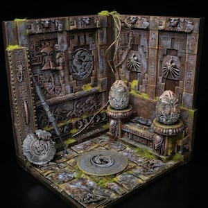 May include: A detailed diorama featuring a stone-like chamber with intricate wall carvings, two textured oval eggs on pedestals, a central circular floor medallion, a long staff, and a round shield, all accented with patches of green moss.