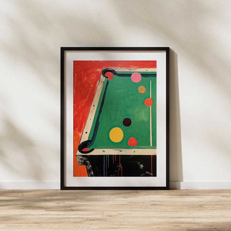 May include: A framed painting depicting a green pool table with six colourful balls on it. The table is set against a red background.