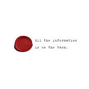 May include: A sticker with a red wax seal featuring the letters "TM" and the phrase "All the information is on the task." The text is in a typewriter-style font, and the sticker has a white background.