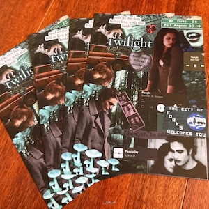 May include: A stack of Twilight-themed art prints. Each print features images of characters, quotes, and scenes from the movie. The prints have a collage design with text and images in shades of green, brown, and black.