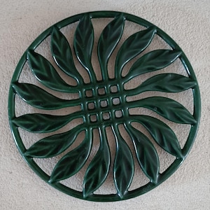 Vintage gietijzeren onderzetter