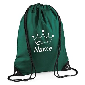 May include: Green drawstring bag with a white crown and the word "Name" printed on it.