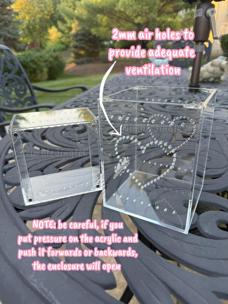 May include: Two clear acrylic enclosures with 2mm air holes for ventilation. One enclosure is open, the other is closed. The text on the image reads: "NOTE: be careful, if you put pressure on the acrylic and push it forwards or backwards, the enclosure will open."