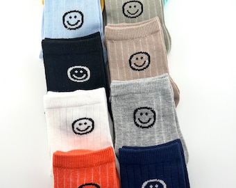 Smily face, happy, fun, colorful set of 10 pairs of kids socks. Soft and durable.