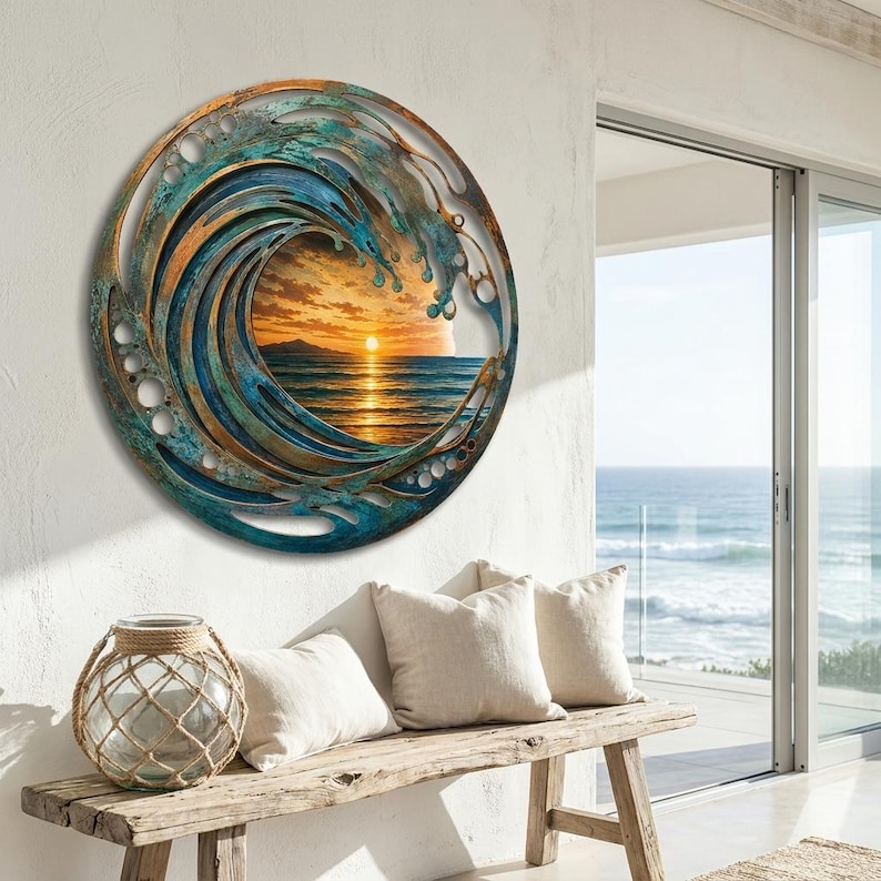 May include: A circular wall art piece featuring a layered metal frame with a weathered teal and bronze finish. The center displays a vibrant sunset over the ocean, with golden light reflecting on the water and a sun positioned near the horizon.