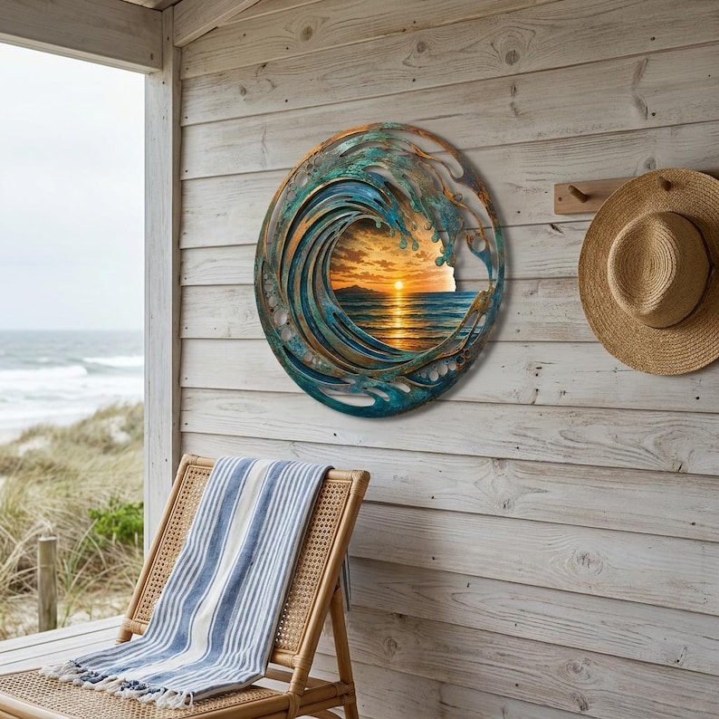 May include: A circular metal wall art piece featuring a layered, cut-out design of a crashing ocean wave in shades of teal, blue, and copper. The center of the wave reveals a printed image of a sunset over the ocean with golden light.