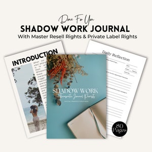 May include: A blue and white journal cover with the text "Shadow Work Therapeutic Journal Prompts" and "Digital Products Boutique". The journal is open to reveal blank pages. The cover is decorated with dried flowers. The text "80 Pages" is in the bottom right corner.