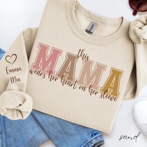 This Mama Wears Her Heart On Her Sleeve Sweatshirt, Personalized Mom Shirt with Kids names on Sleeve, Cute Momma, Mother&#39;s Day Gift