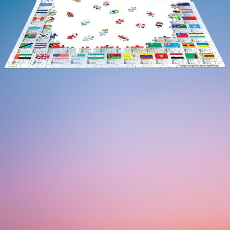 Peut inclure: Un puzzle de 1000 pièces représentant les drapeaux du monde. La boîte du puzzle est bleue avec du texte blanc et une image du puzzle terminé. Le puzzle est fabriqué par Eurographics.