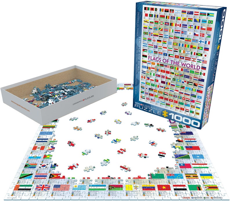 K&ouml;nnte beinhalten: Ein 1000-teiliges Puzzle mit den Flaggen der Welt. Das Puzzle ist teilweise auf einer wei&szlig;en Oberfl&auml;che zusammengesetzt, wobei die Schachtel daneben ge&ouml;ffnet ist. Die Schachtel hat einen blauen Hintergrund mit dem Text "Flaggen der Welt" in wei&szlig;.