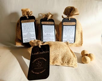 May include: Four small burlap drawstring bags containing wildflower seed bombs, each with a black rectangular tag. Three tags are labeled Midwest, Pacific Northwest, and Southeast, while the fourth tag features the LeafCrafters logo and text.