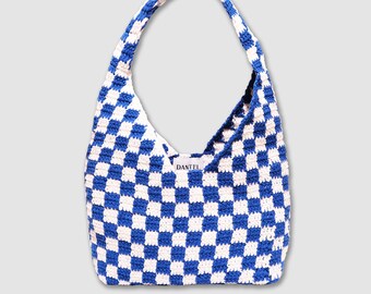 May include: Blue and white checkered crochet tote bag with a DANTEL label.