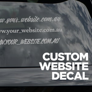 May include: White custom website decal with the text "www.your_website.com.au" and "CUSTOM WEBSITE DECAL" on a black car window.