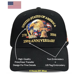 May include: A black baseball cap featuring a graphic of a bald eagle, the Statue of Liberty, and the Liberty Bell. The text reads UNITED STATES OF AMERICA, 1776, 2026, and 250TH ANNIVERSARY. The design includes a US flag motif in the background.