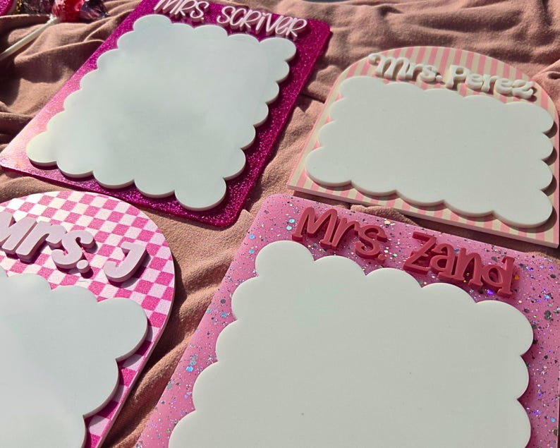 Personalized teacher name dry erase board with scalloped design used as a classroom desk notepad. Reusable whiteboard writing surface perfect for reminders, lesson plans, and daily tasks. Popular gift idea for teacher appreciation week, new teacher classroom setup, and back to school teacher desk decor.