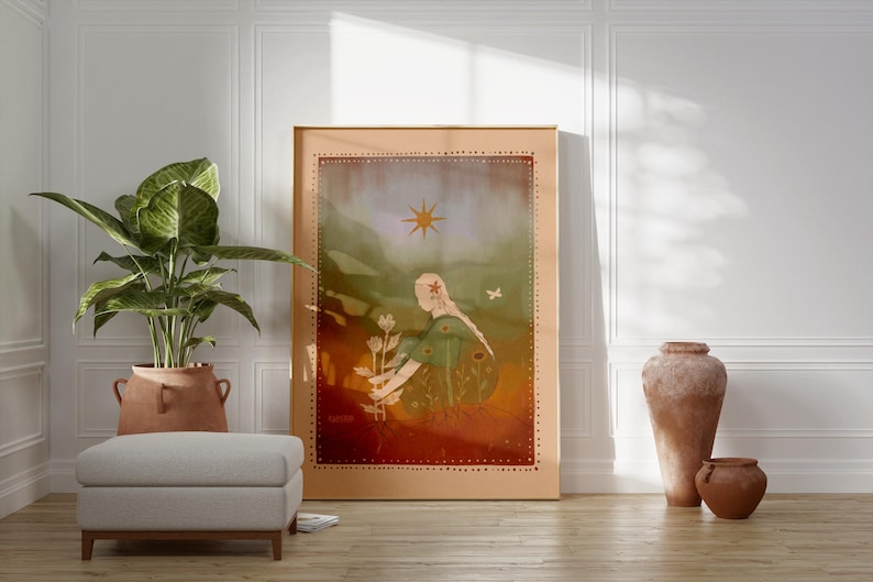 May include: A framed art print featuring a woman with butterfly wings, holding flowers, under a sun. The artwork has a warm color palette with a light brown frame. A potted plant, ottoman, and terracotta vases are in the foreground.