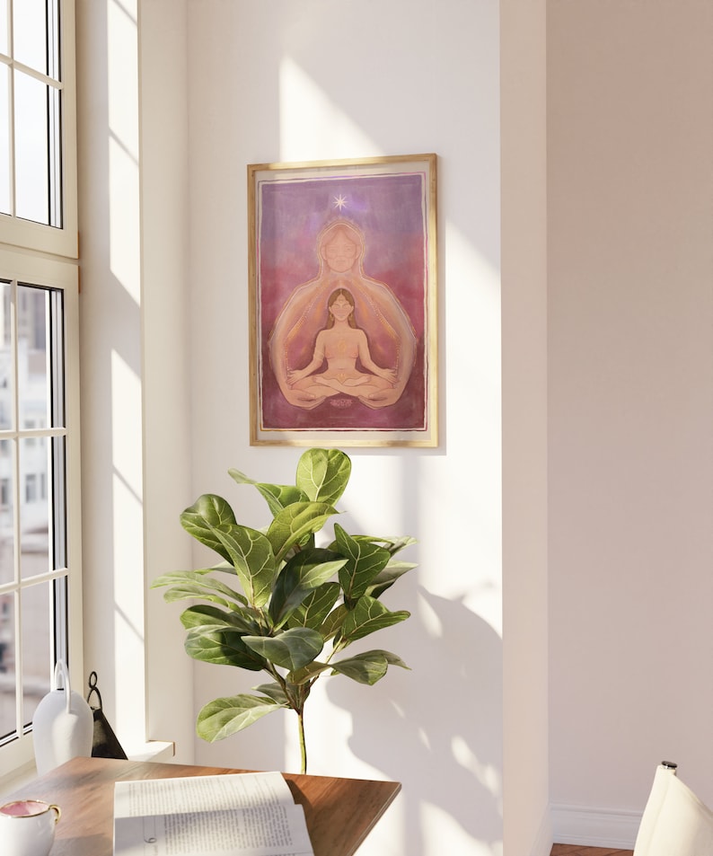 May include: A framed print of a watercolor painting depicting a woman meditating with a glowing aura. The woman is sitting in a lotus position with her eyes closed. The background is a soft purple and pink gradient with a single white star at the top.