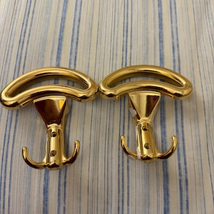 Vintage due Ganci per parete Appendiabiti della Ghedini  finitura oro.