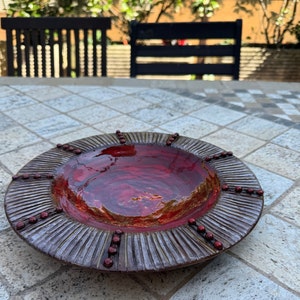 Vintage Italian pottery round serving plate brown and red with rim decorations. Signed