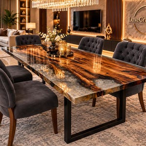 May include: A rectangular dining table featuring a polished wood slab with a live edge and a translucent resin inlay, supported by a black metal frame, surrounded by six dark gray upholstered chairs with tufted backrests.