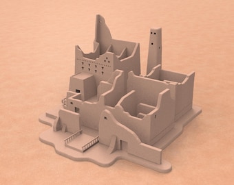 May include: A light beige architectural model of a Middle Eastern village. The model features multiple buildings with varying heights, including a tower and structures with open walls. The model sits on a light brown surface.