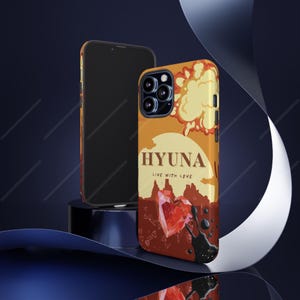 May include: A phone case with a vibrant design featuring the name "HYUNA" in a bold font, accompanied by the phrase "LIVE WITH LOVE." The case showcases a sunset-themed background with a heart and abstract elements.