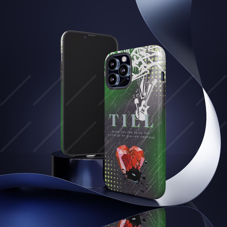May include: A phone case with a green and black gradient design featuring the word "TILL" in white, a guitar illustration, and a red heart graphic. The case is next to a black phone.
