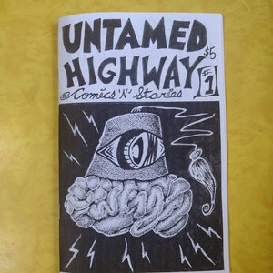 May include: A black and white comic book cover with the title "Untamed Highway" and the number "1" in a circle. The cover features a stylized illustration of a brain with an eye in a fez.