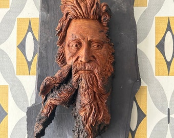 Hand Carved Cottonwood Bark Wood-spirit face Sculpture mounted on Slate