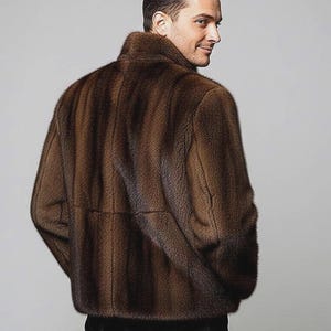 May include: A brown fur jacket with a high collar. The jacket has a vertical striped pattern and is worn by a person. The person is looking over their shoulder. The jacket appears to be made of a soft, luxurious material.