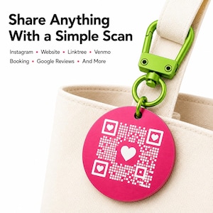 May include: A round, hot pink metal tag featuring a white QR code with heart icons, attached to a bright green carabiner clip. The text reads: Share Anything With a Simple Scan. Instagram, Website, Linktree, Venmo, Booking, Google Reviews, And More.