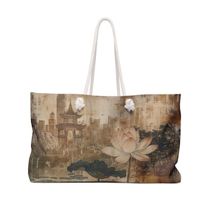 May include: Large tote bag featuring a vintage-style Asian landscape with a pagoda, city skyline, and a lotus flower. The bag has white rope handles and a neutral color palette.