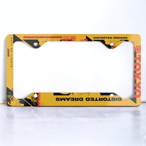 Automotive anime license plate frame, gold kawaii license plate frame, Japanese writing, kanji car decorations, Tokyo, Japan, crying manga