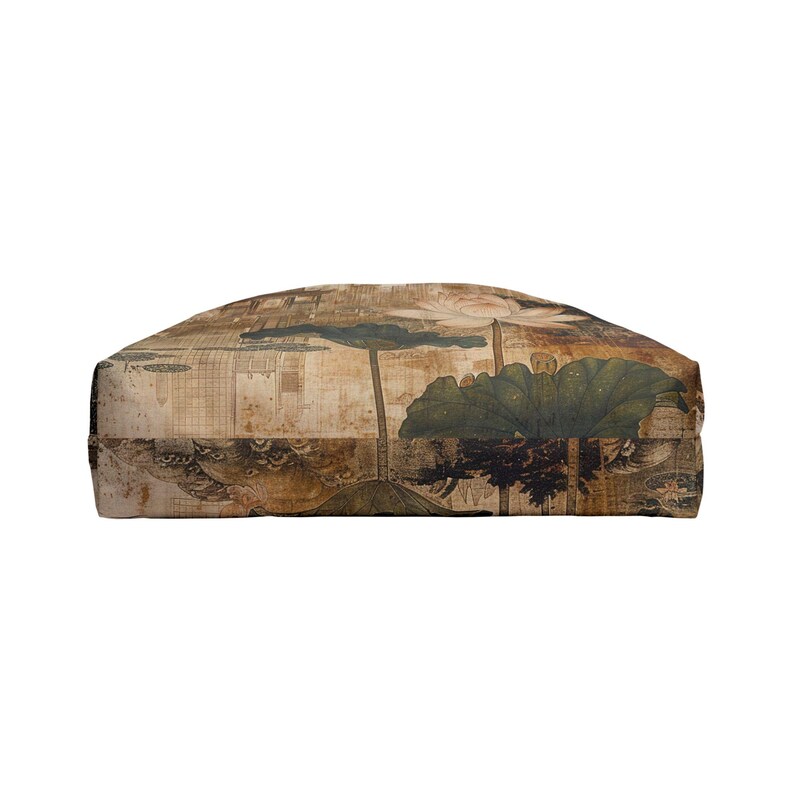 May include: A rectangular decorative pillow featuring a vintage-style botanical print. The design includes a large lotus flower, leaves, and a landscape scene in shades of brown, green, and beige. The pillow has a soft, textured appearance.