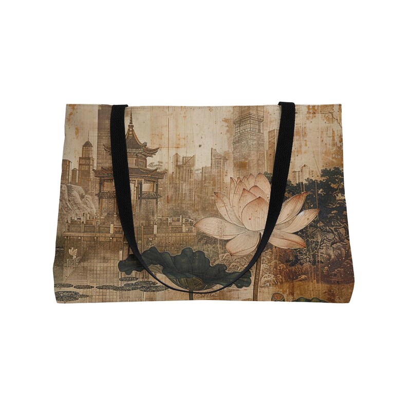 May include: Tote bag featuring an Asian-inspired design with a large lotus flower, a pagoda, and a cityscape in the background. The bag has black straps and a beige background with a vintage aesthetic.