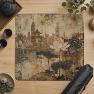 May include: A square mat featuring a sepia-toned illustration of a traditional pagoda and city skyline reflected in water, with a large lotus flower and dark green lily pads in the foreground. The design has a weathered, textured appearance.